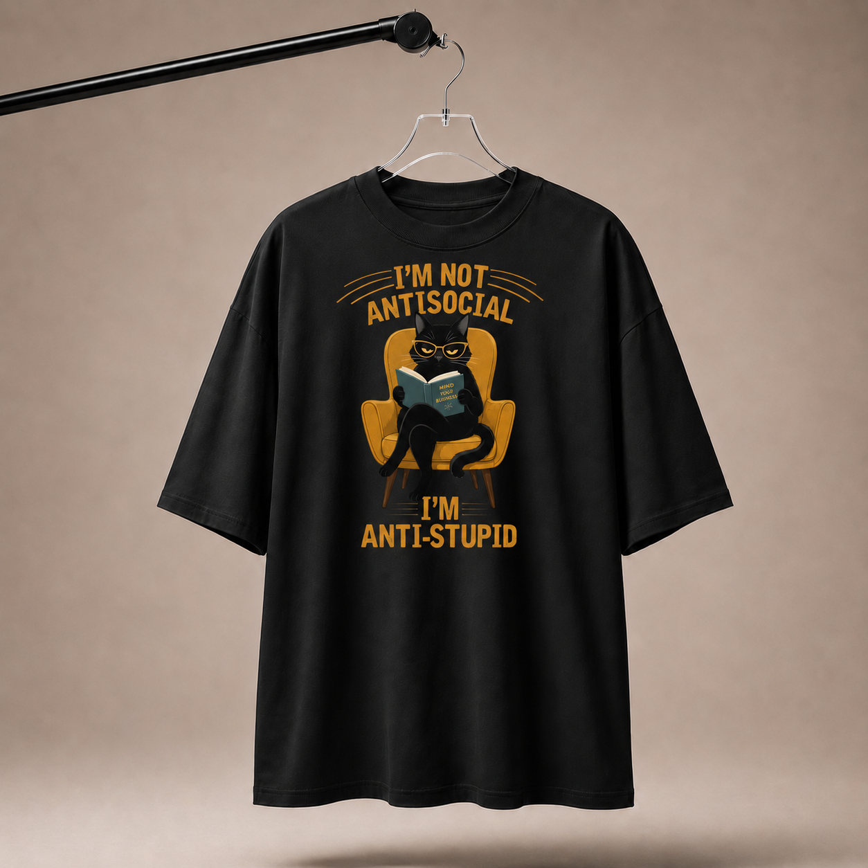 Black t-shirt with graphic design and text on a beige background