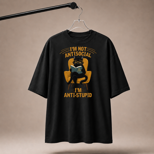 Black t-shirt with graphic design and text on a beige background