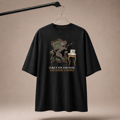 Black t-shirt with graphic design and text on a beige background