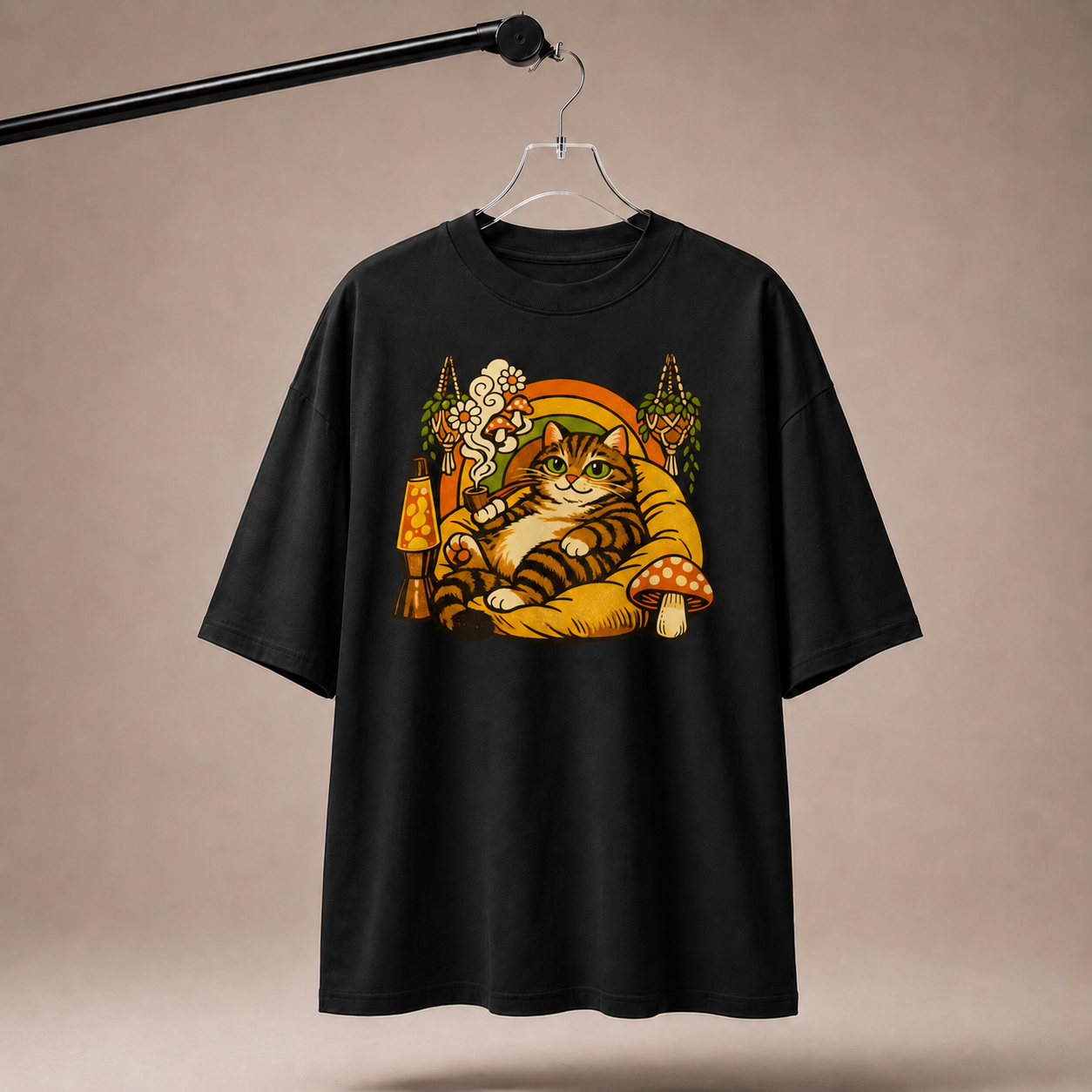 Black t-shirt with a cat graphic on a beige background