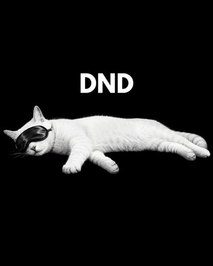 White cat with black mask lying down on a black background with 'DND' text.
