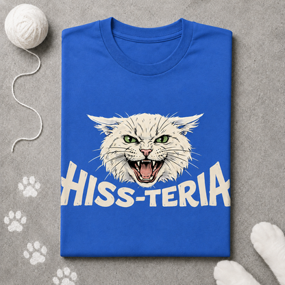 Blue t-shirt with a cat graphic and 'HISS-TERIA' text on a gray surface with paw prints.