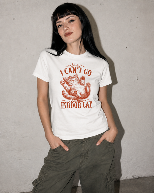 Person wearing a white t-shirt with a graphic and text against a plain background