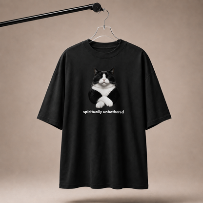 Black t-shirt with a cat graphic and 'spiritually unbothered' text on a beige background