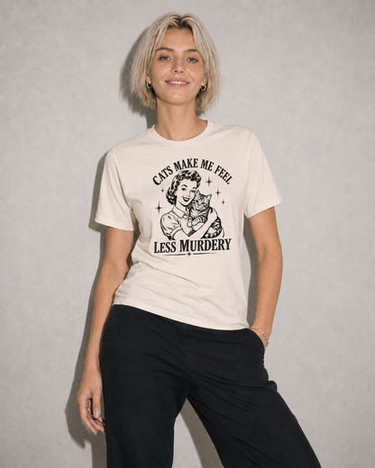 Person wearing a t-shirt with a graphic design and text against a plain background