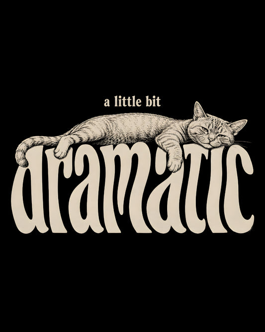 Cat lying on the word 'dramatic' with text 'a little bit' above on a black background