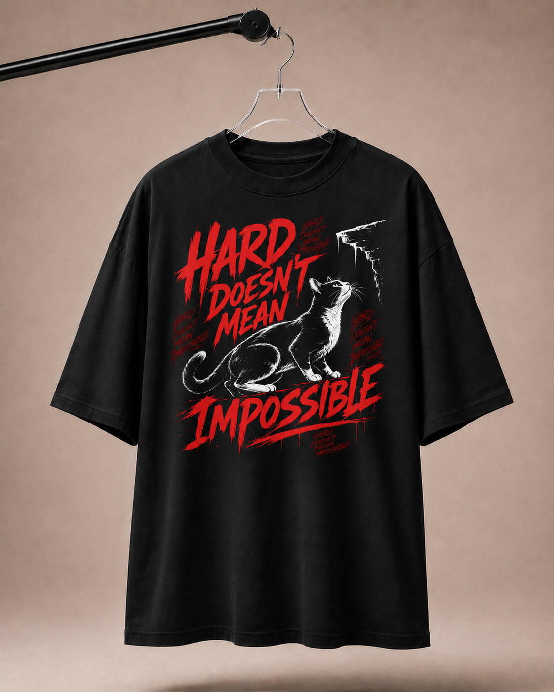 Black t-shirt with red and white graphic and text on a beige background