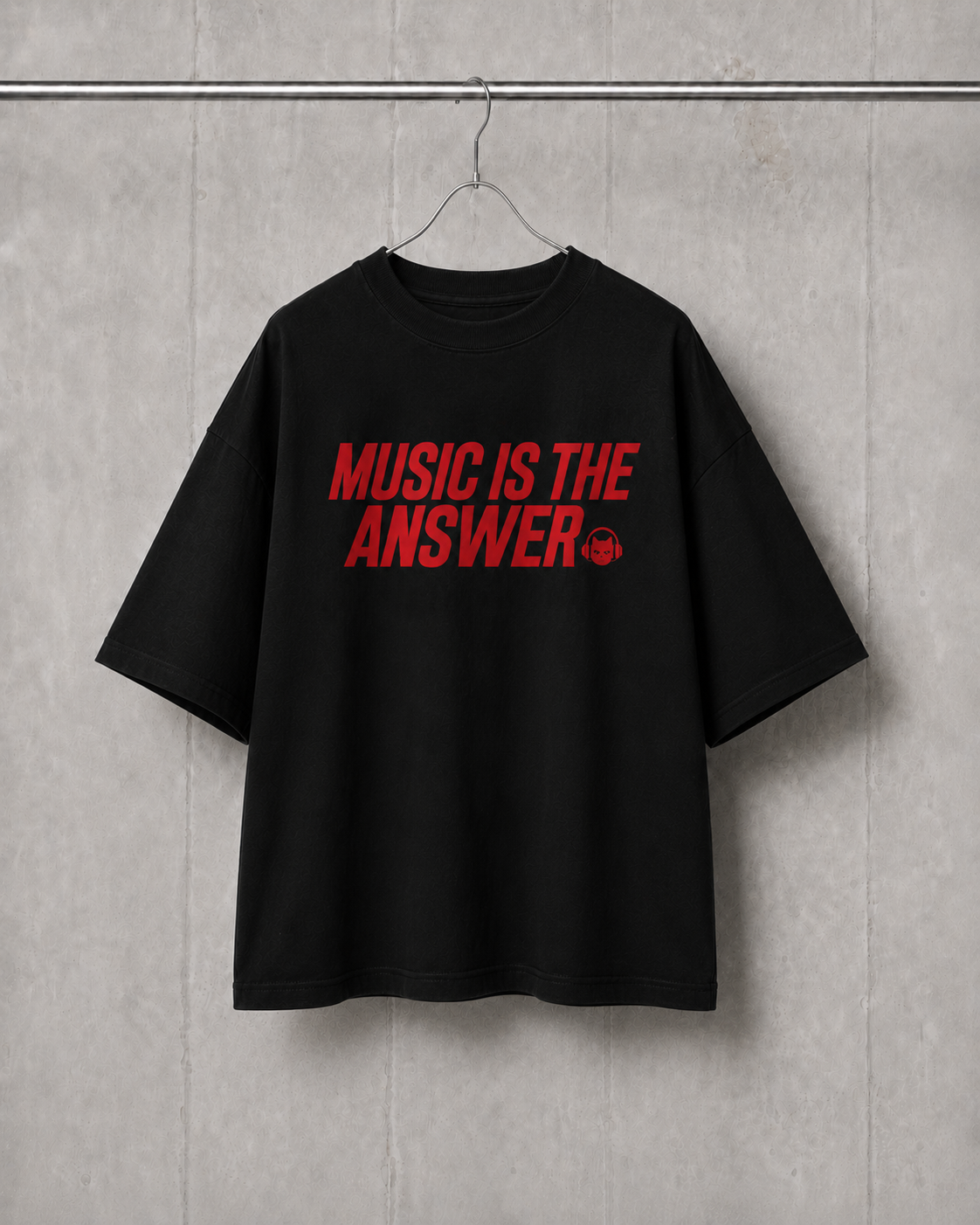 Black t-shirt with 'Music is the Answer' text in red on a gray wall background
