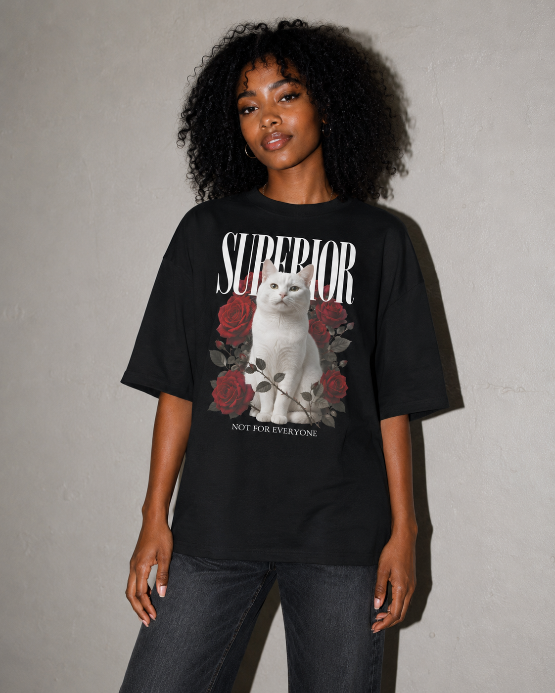 Person wearing a black t-shirt with a graphic design and text against a gray background
