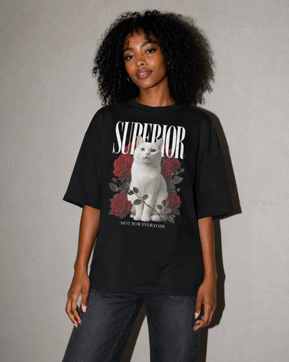 Person wearing a black t-shirt with a graphic design and text against a gray background