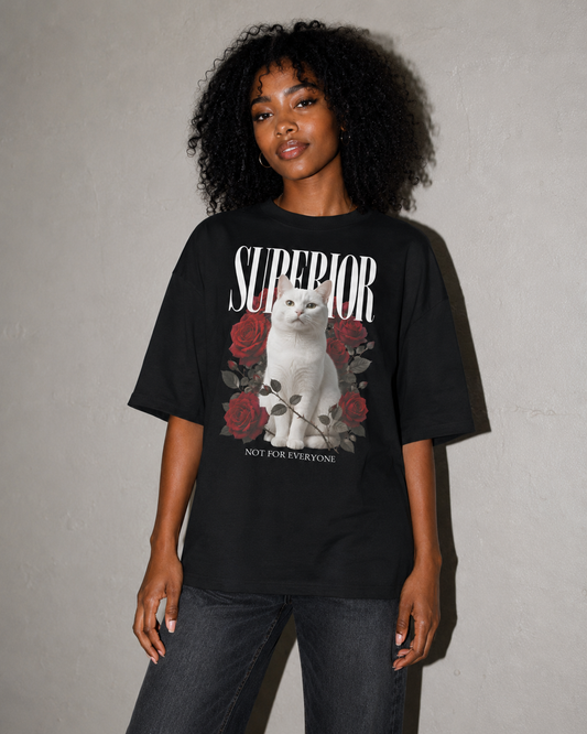 Person wearing a black t-shirt with a graphic design and text against a gray background